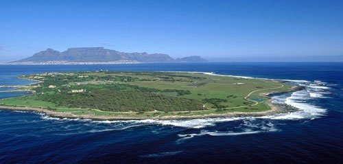 Aerial view of Robben Island with the city of Cape Town and Table Mountain in the background
